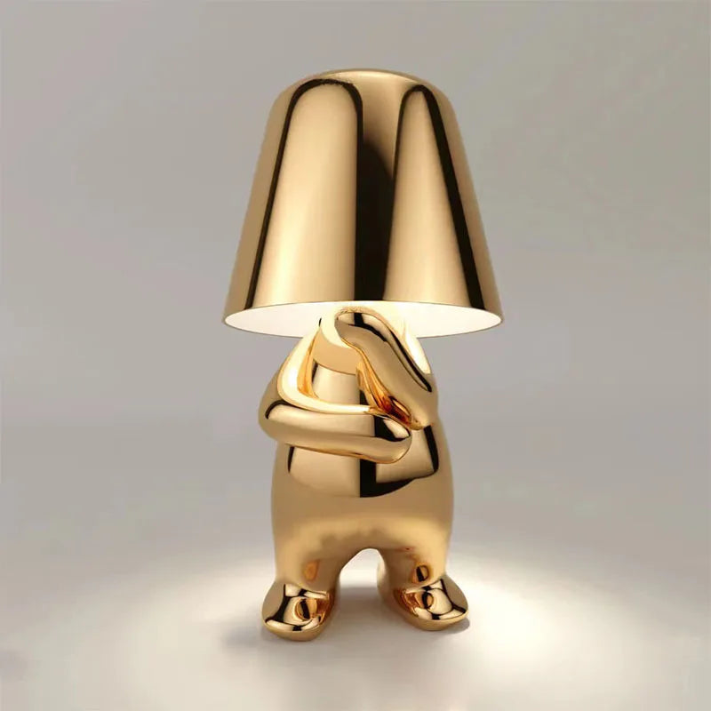 Gold metallic dog figurine desk lamp with lampshade head, glowing dimmable ambient light, shiny decorative sculpture design