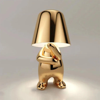 Gold metallic dog figurine desk lamp with lampshade head, glowing dimmable ambient light, shiny decorative sculpture design
