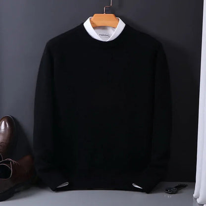 Black cashmere blend crewneck sweater on wooden hanger, styled with white collar shirt and brown leather dress shoes.