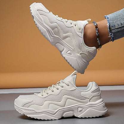 White mesh lace-up chunky platform sneakers for women with thick wavy sole and beaded ankle accessory