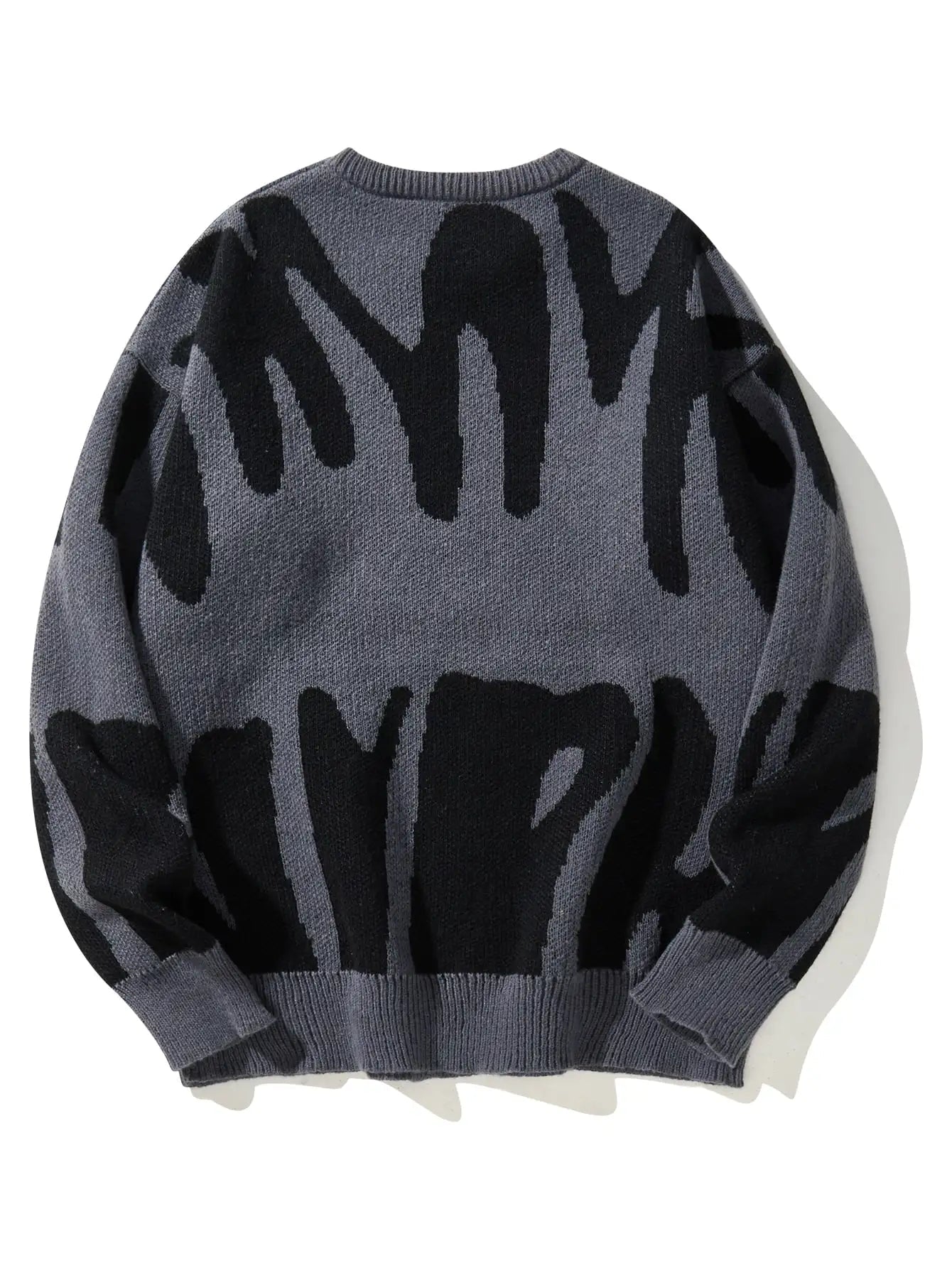 Men's oversized wool knit crewneck sweater in grey with bold black abstract brushstroke pattern, back view.