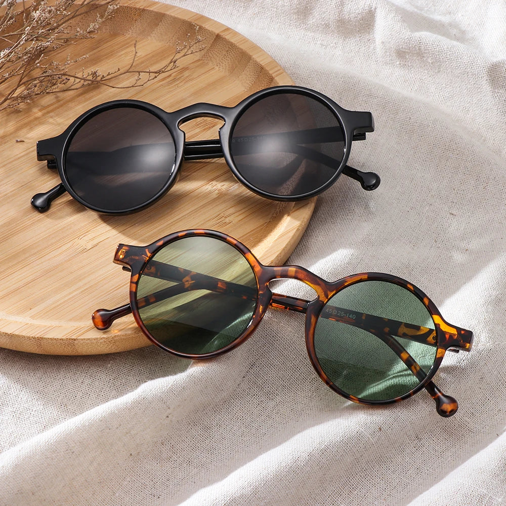 Round frame sunglasses with UV400 protection in black and tortoiseshell brown for men and women