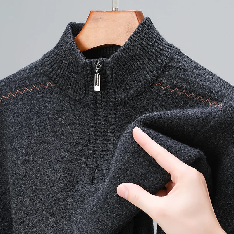 Dark gray men's wool blend quarter-zip sweater with ribbed mock neck collar and zigzag pattern detail on shoulders.