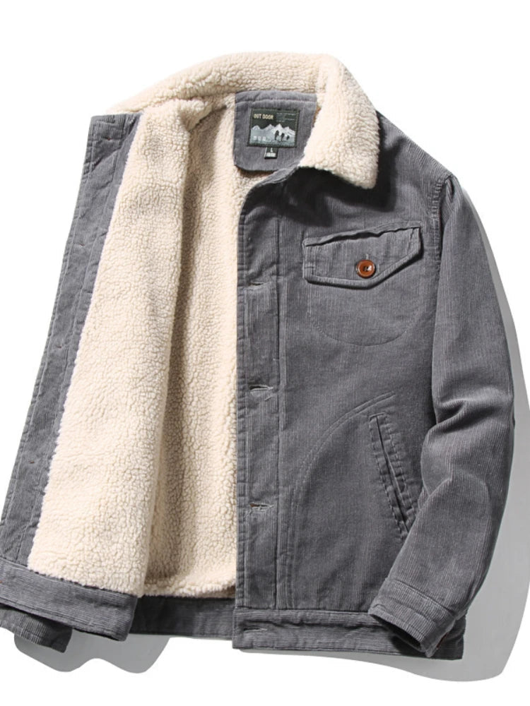 Gray men's corduroy jacket with cream sherpa fleece lining and collar, chest pocket, and brown button detail