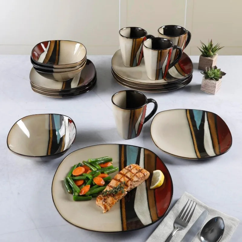 16-piece stoneware dinnerware set with bold striped pattern in red, teal, and cream, displayed with plated salmon meal.