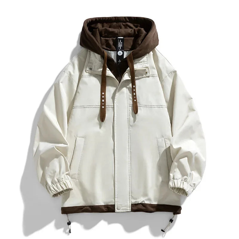 Cream zip-up hooded jacket with brown contrast hood, drawstrings, elastic cuffs, and front pockets for men.