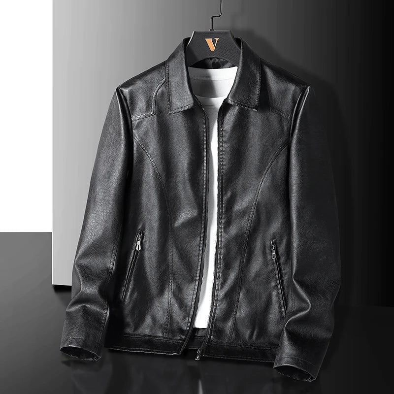 Black leather zip-up jacket for men hanging on hanger with collar and side pockets