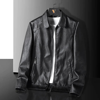 Black leather zip-up jacket for men hanging on hanger with collar and side pockets