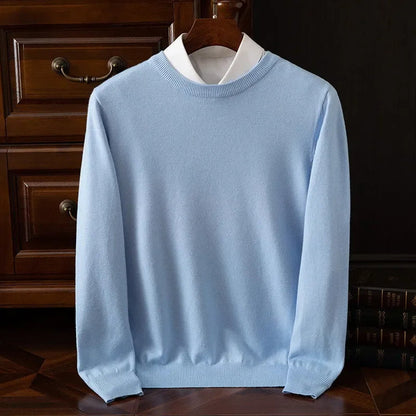 Light blue cashmere blend crewneck sweater for men on wooden hanger with white collar shirt layered underneath
