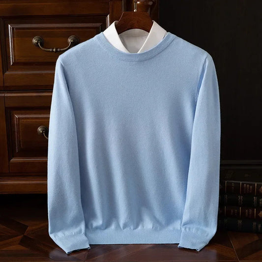 Light blue cashmere blend crewneck sweater for men on wooden hanger with white collar shirt layered underneath