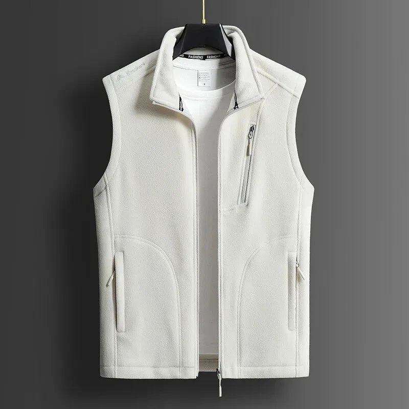 White men's fleece zip-up vest with stand collar, chest zip pocket, and side pockets, displayed on hanger