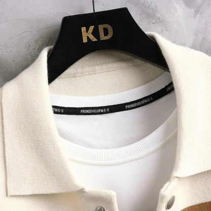 Close-up of cream wool blend men's cardigan collar on black KD hanger showing white ribbed inner neckband with brand label