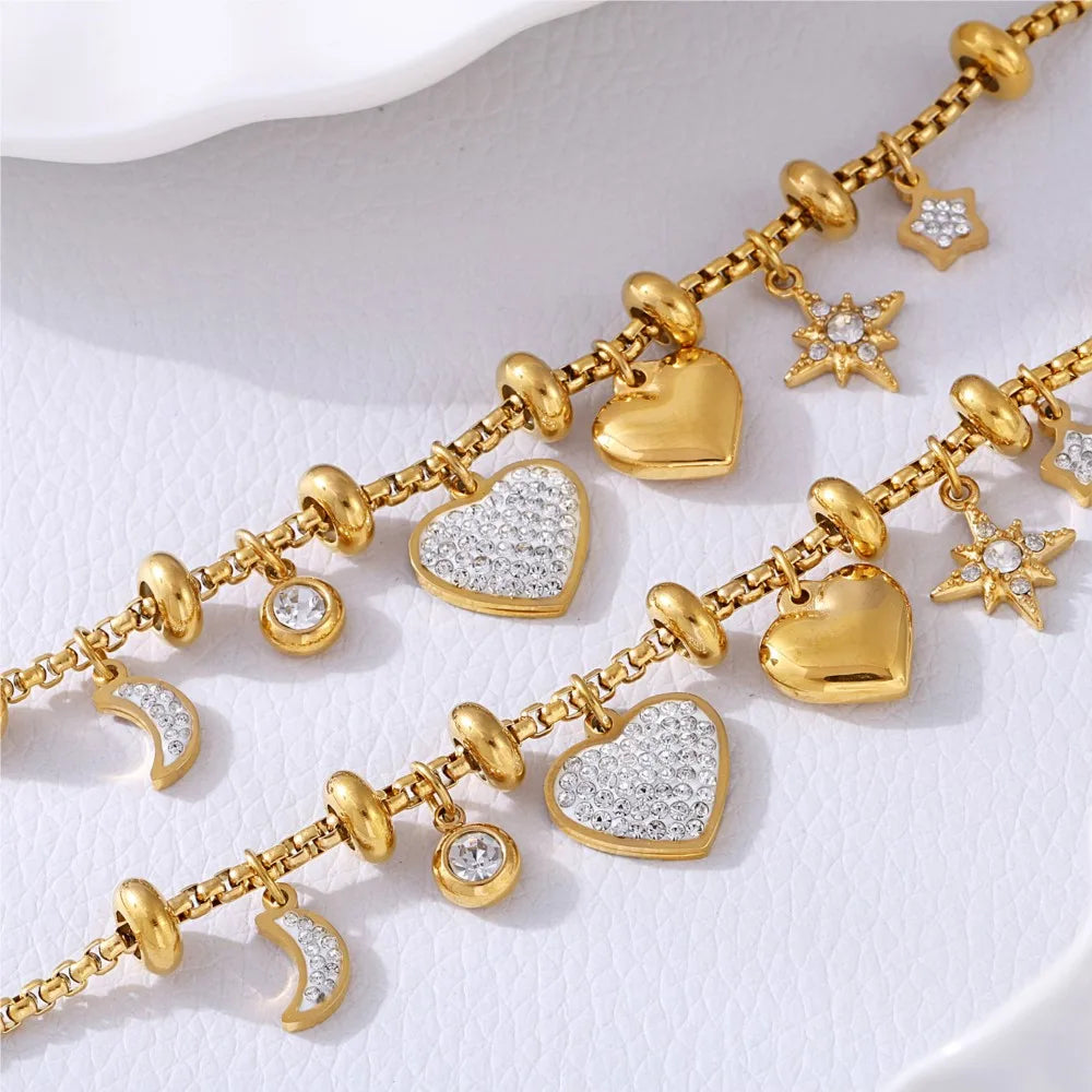 Gold heart charm bracelet with crystal stars and moon pendants on box chain for women