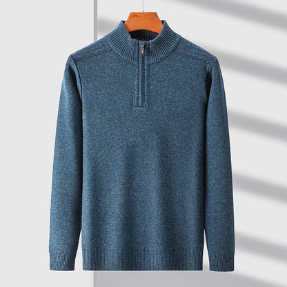 Blue wool blend men's quarter-zip sweater with mock neck collar, ribbed cuffs and hem, displayed on hanger