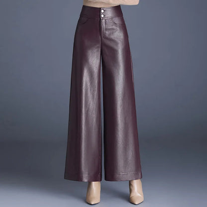 Burgundy high-rise wide-leg vegan leather pants with double button closure, shown with beige heels on gray background.
