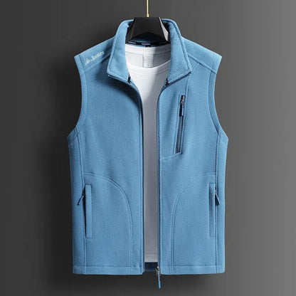 Light blue men's fleece zip-up vest with stand collar, chest pocket, and side zip pockets, displayed on hanger