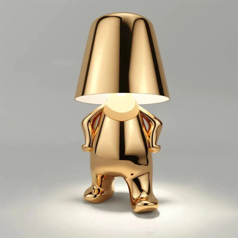 Gold chrome dog figurine desk lamp with lampshade head, dimmable ambient light, shiny metallic finish on gray background