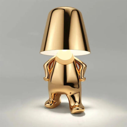 Gold chrome dog figurine desk lamp with lampshade head, dimmable ambient light, shiny metallic finish on gray background