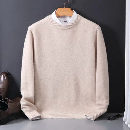 Beige cashmere blend men's crewneck sweater on hanger with white collar shirt underneath, paired with brown leather shoes.