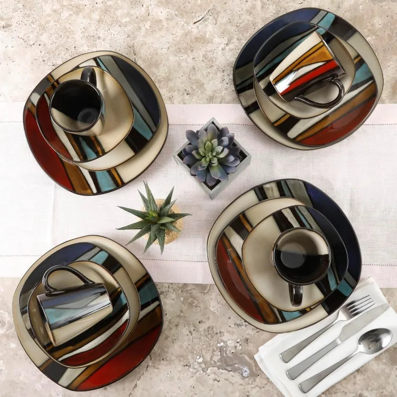 16-piece stoneware dinnerware set for 4 with colorful geometric stripes, including plates, bowls, and mugs, viewed from above.
