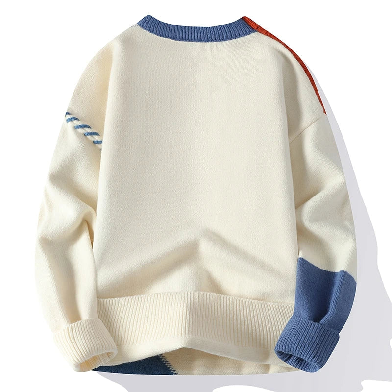 Men's cream color block cable knit wool sweater with blue and orange accents, ribbed collar, cuffs, and hem, back view.