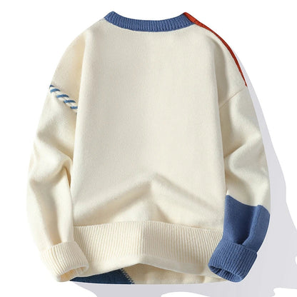 Men's cream color block cable knit wool sweater with blue and orange accents, ribbed collar, cuffs, and hem, back view.